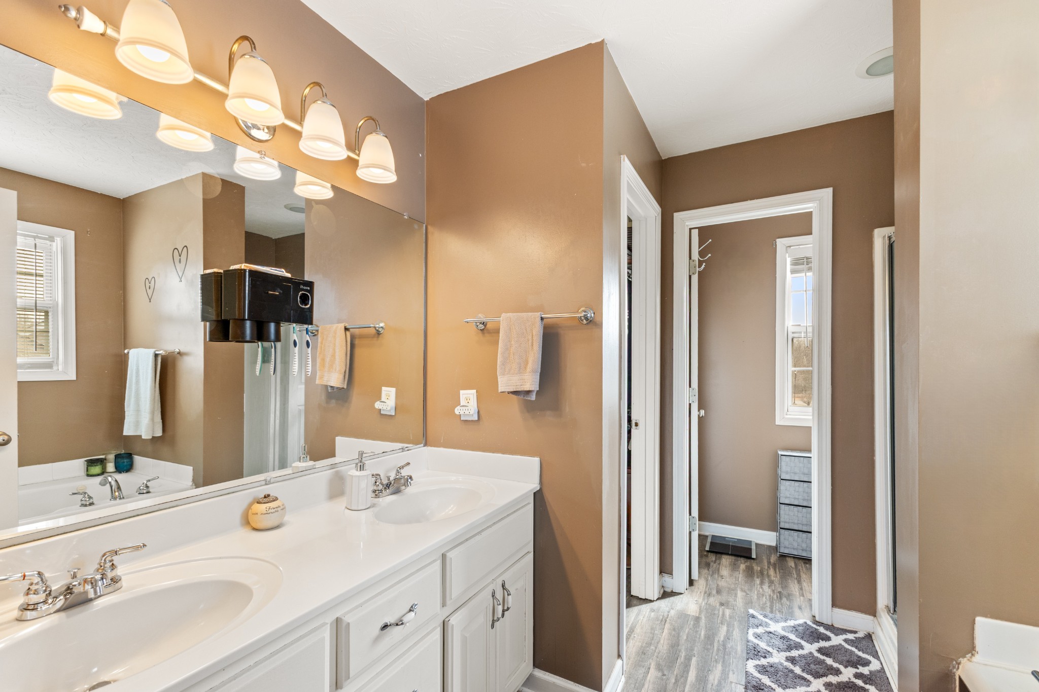 205 Emerald Circle Pleasant View, TN 37146 - Photo 11 of 22 a spacious bathroom with a sink a large mirror and a shower