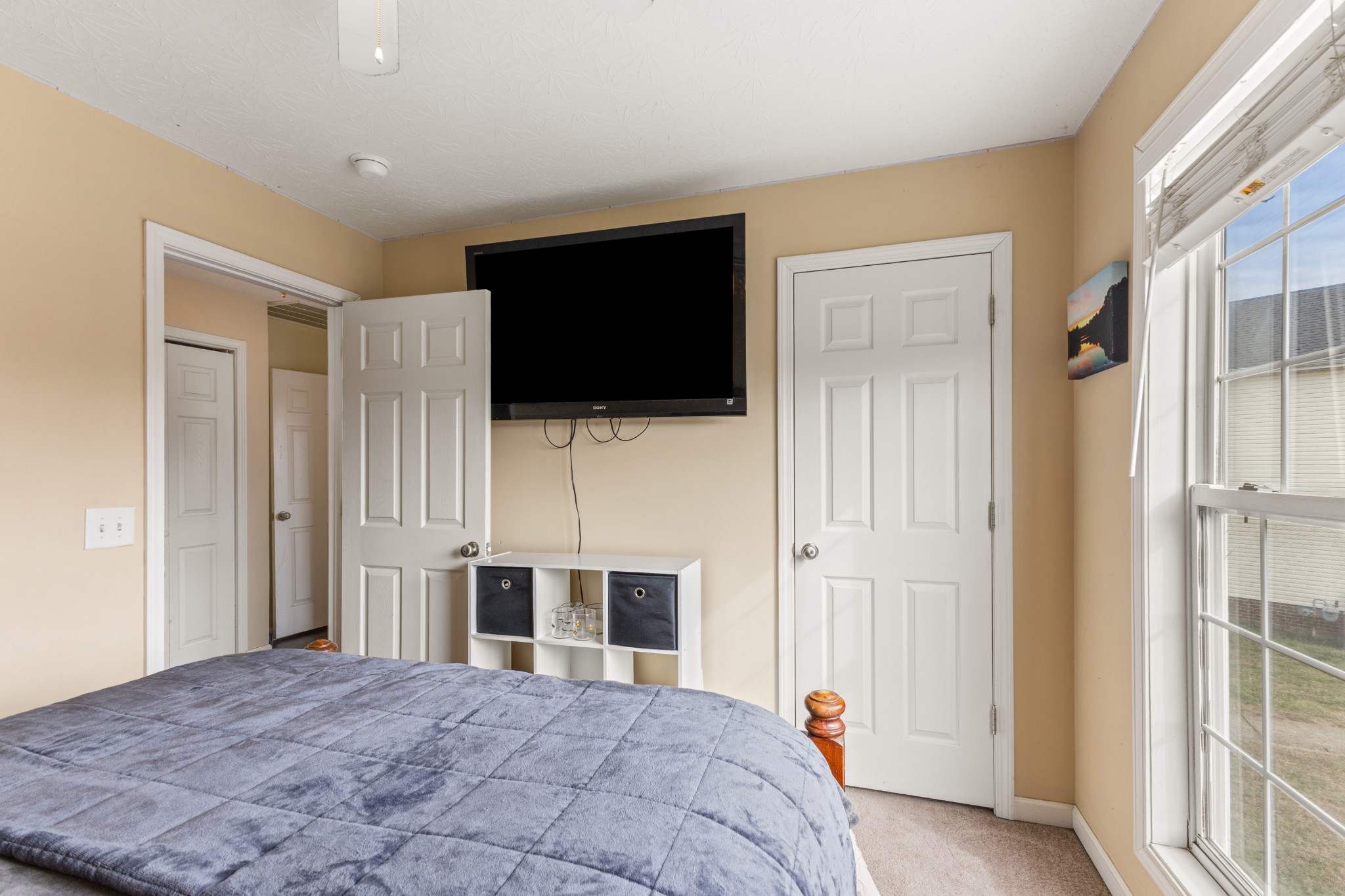 205 Emerald Circle Pleasant View, TN 37146 - Photo 16 of 22 a bedroom with a bed and a flat screen tv