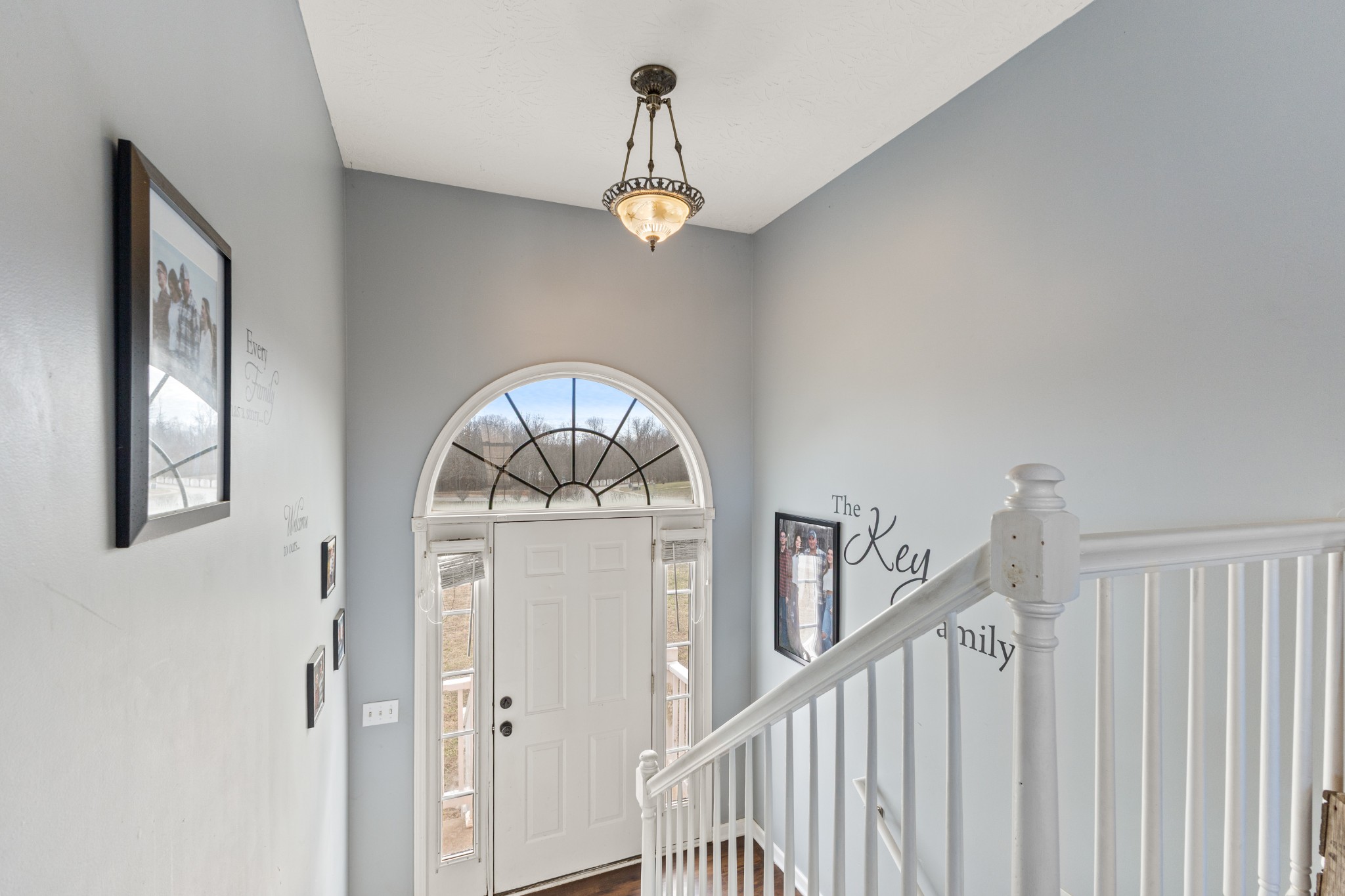 205 Emerald Circle Pleasant View, TN 37146 - Photo 3 of 22 a view of staircase with chandelier