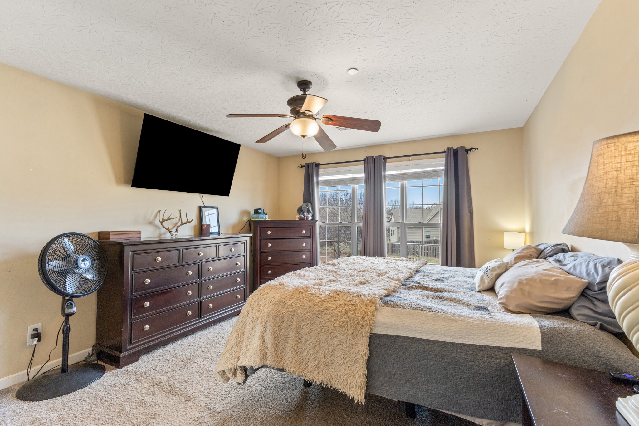 205 Emerald Circle Pleasant View, TN 37146 - Photo 9 of 22 a bedroom with a bed and a flat screen tv