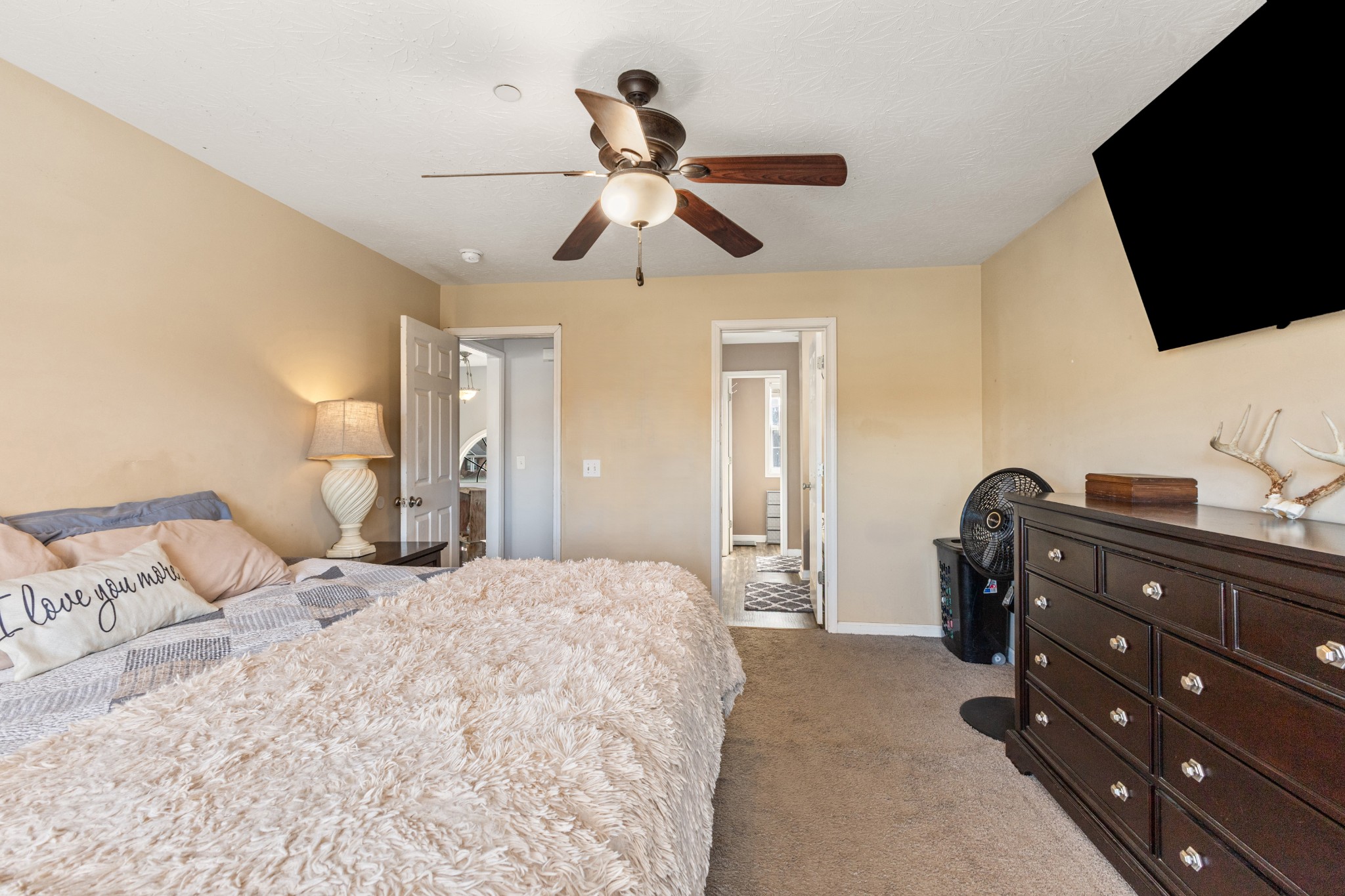 205 Emerald Circle Pleasant View, TN 37146 - Photo 10 of 22 a bedroom with a bed and flat screen tv