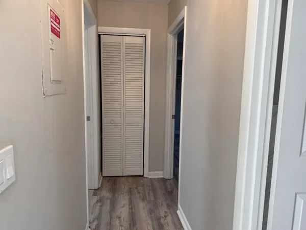 a view of an entryway with wooden floor
