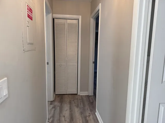 a view of an entryway with wooden floor