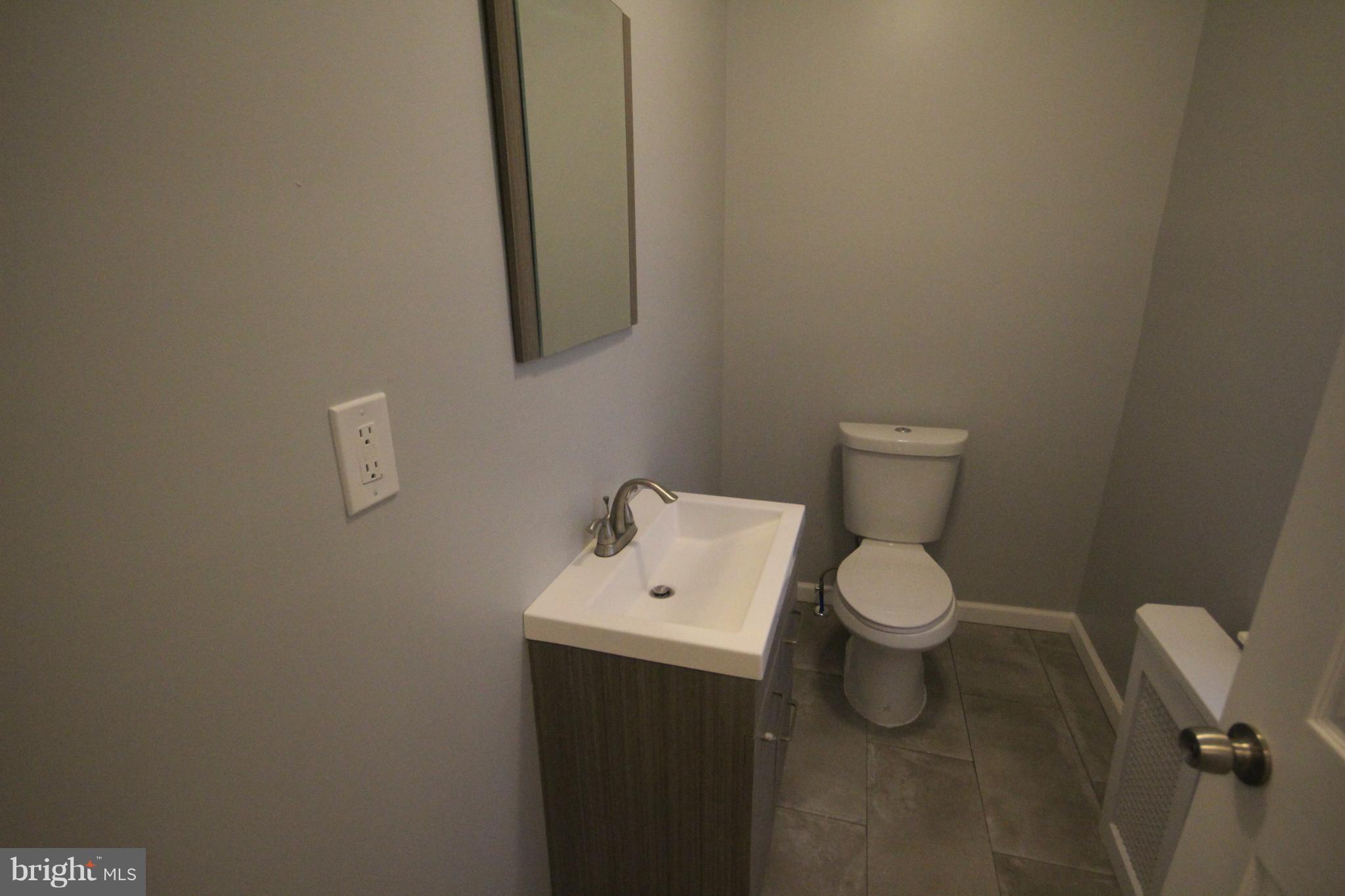 162 Edinburg Road Hamilton, NJ 08619 - Photo 11 of 17 a white toilet sitting next to a white sink