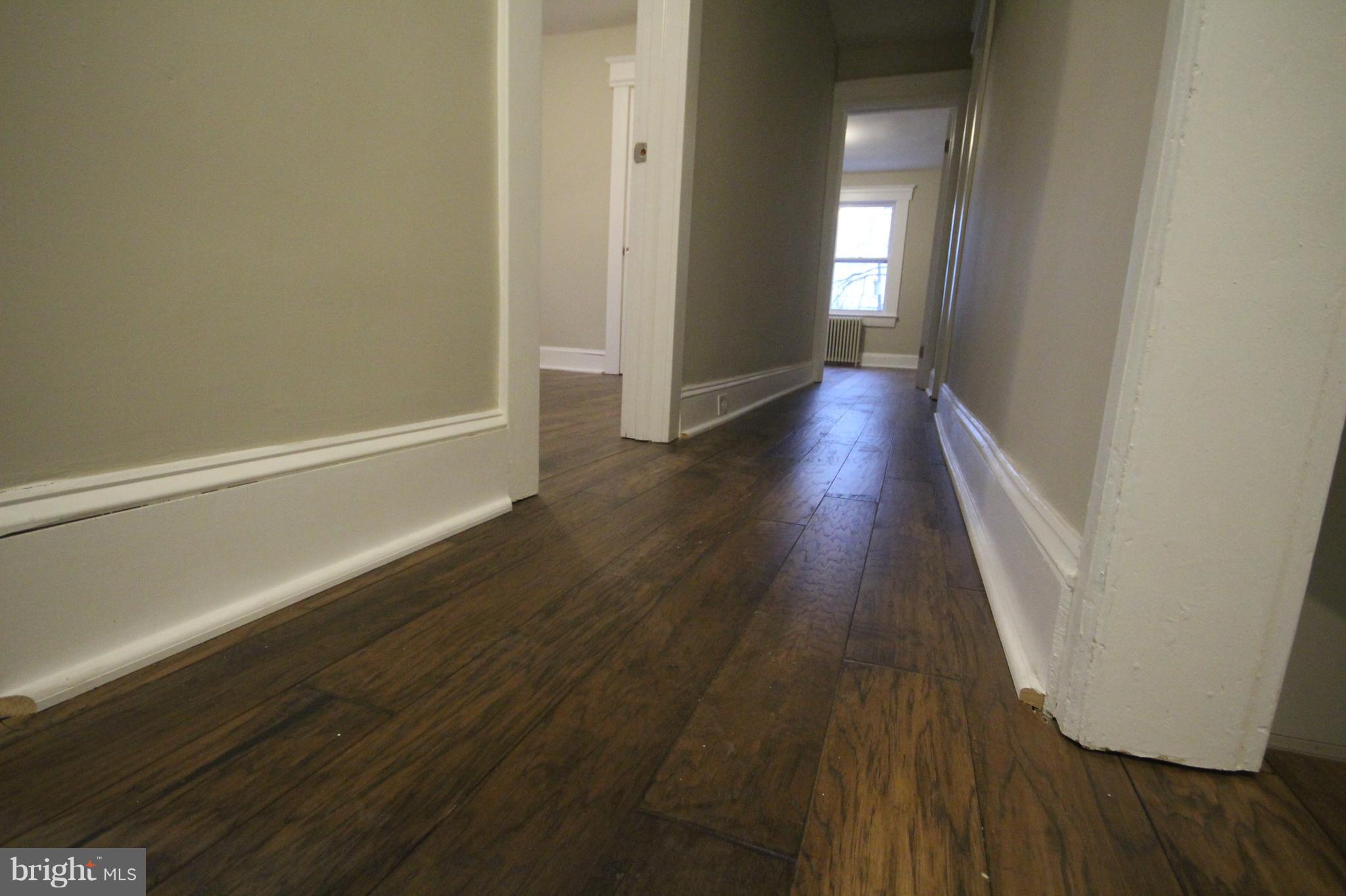 162 Edinburg Road Hamilton, NJ 08619 - Photo 16 of 17 a view of a hallway with wooden floor