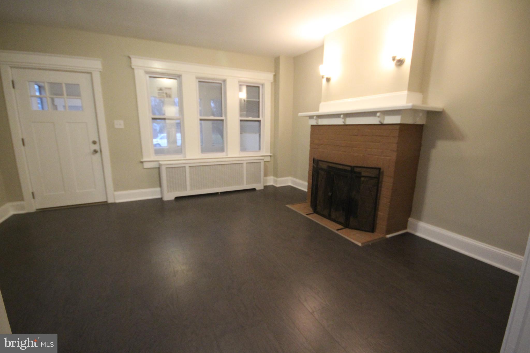 162 Edinburg Road Hamilton, NJ 08619 - Photo 5 of 17 an empty room with windows and fireplace