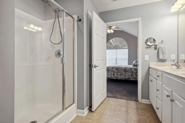 a view of walk in closet with clothes