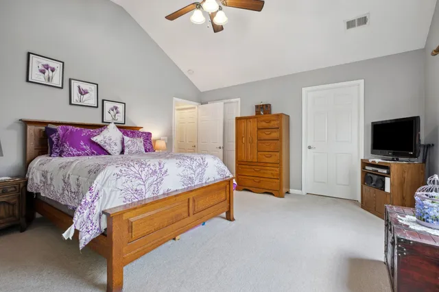 a bathroom with a sink toilet a mirror and shower