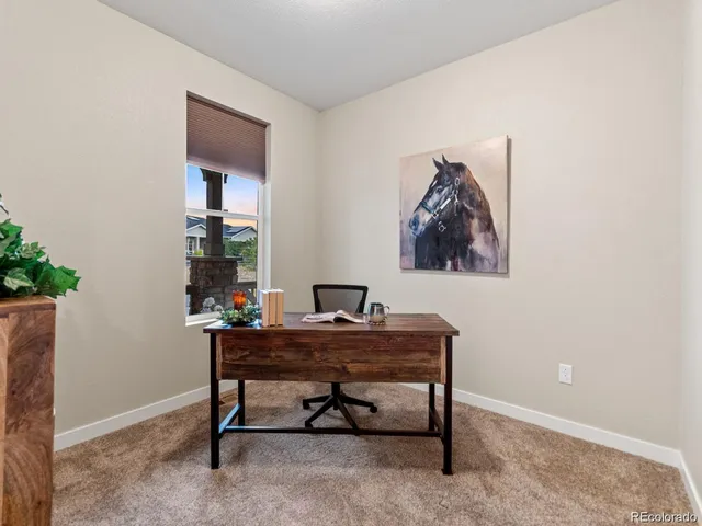 a view of a workspace with furniture