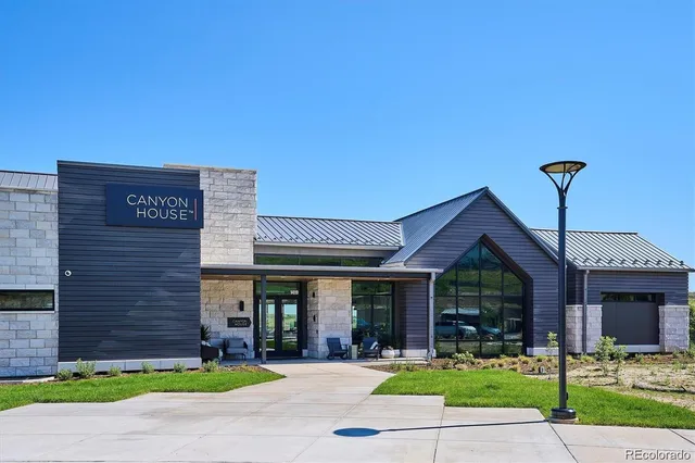 a front view of a building with a garden