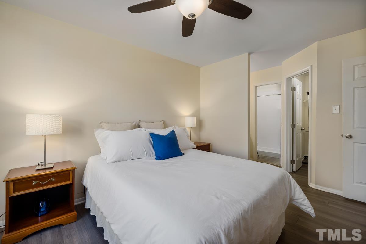 3702 Chimney Ridge Place, Unit 201 Durham, NC 27713 - Photo 13 of 27 a bedroom with a bed and a lamp