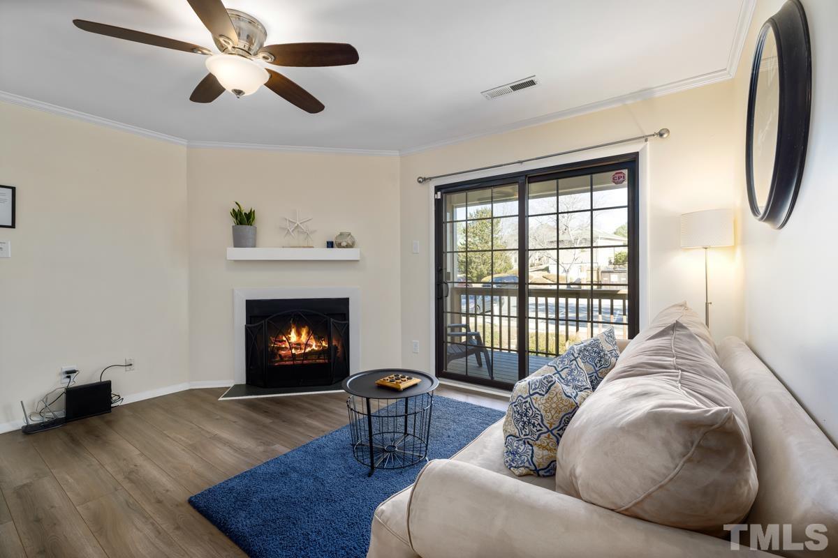 3702 Chimney Ridge Place, Unit 201 Durham, NC 27713 - Photo 2 of 27 a living room with furniture and a fireplace