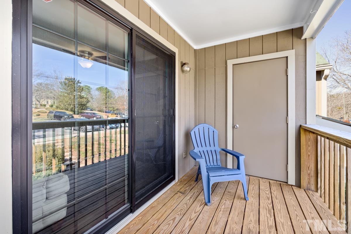 3702 Chimney Ridge Place, Unit 201 Durham, NC 27713 - Photo 25 of 27 a view of a hallway with wooden floor and furniture