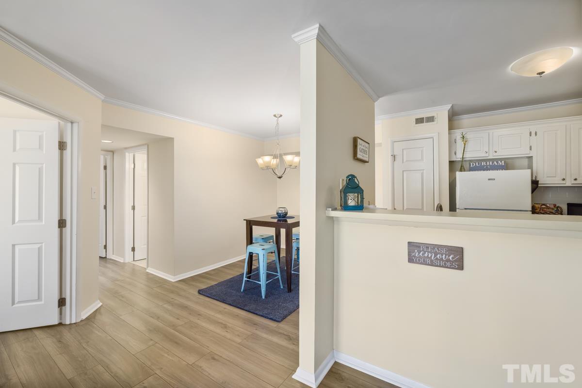 3702 Chimney Ridge Place, Unit 201 Durham, NC 27713 - Photo 26 of 27 a view of kitchen with furniture and wooden floor
