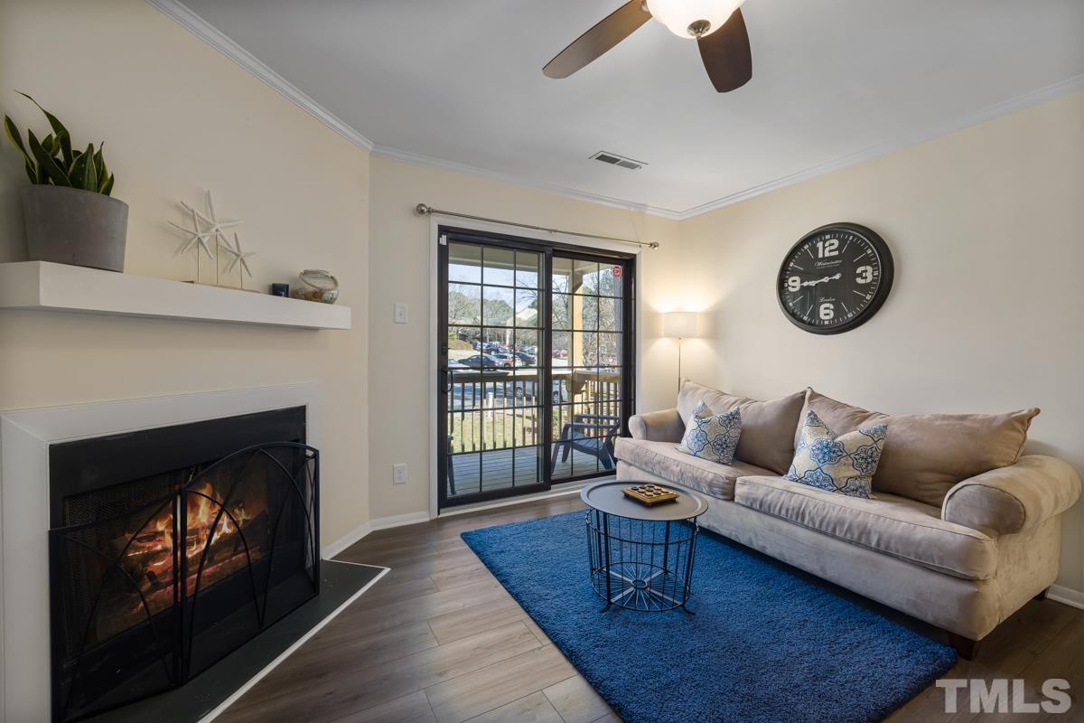 3702 Chimney Ridge Place, Unit 201 Durham, NC 27713 - Photo 3 of 27 a living room with furniture and a fireplace