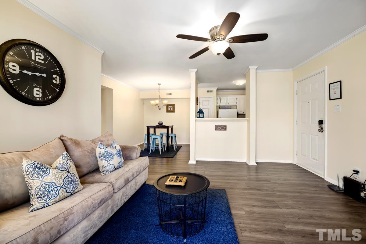 3702 Chimney Ridge Place, Unit 201 Durham, NC 27713 - Photo 4 of 27 a living room with furniture and wooden floor