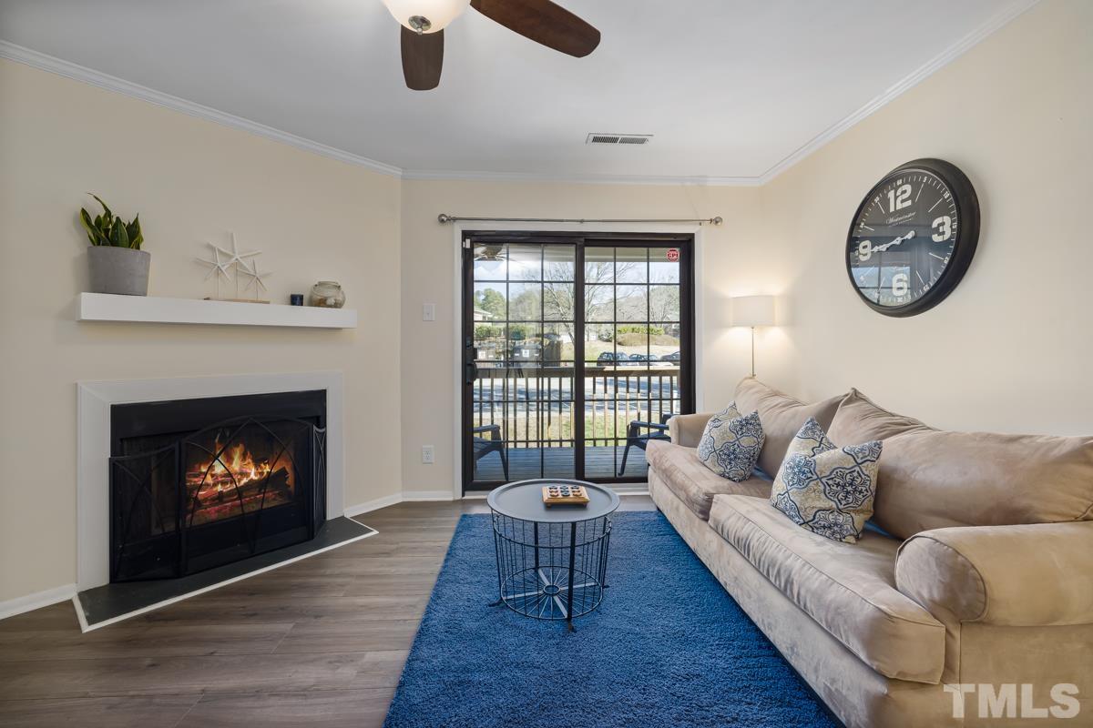 3702 Chimney Ridge Place, Unit 201 Durham, NC 27713 - Photo 5 of 27 a living room with furniture and a fireplace