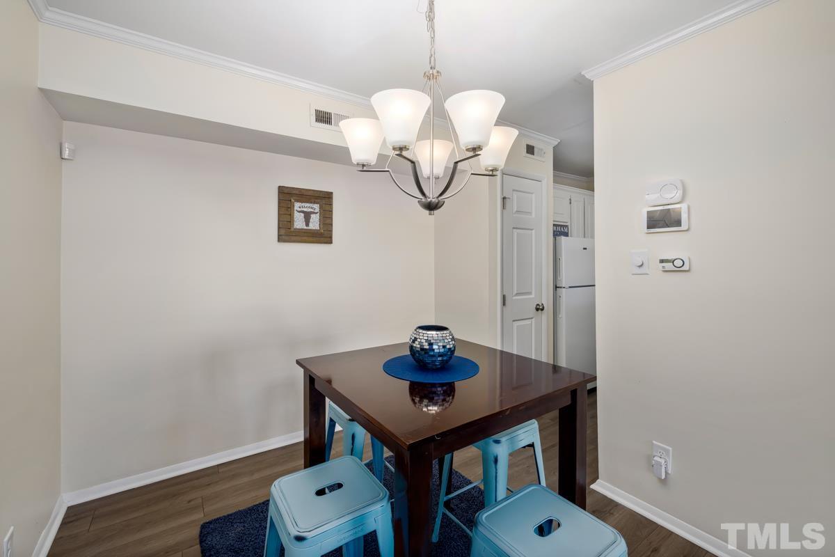 3702 Chimney Ridge Place, Unit 201 Durham, NC 27713 - Photo 10 of 27 a view of a room that has a table and a table in it