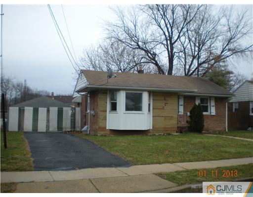 11 Stevens Road Edison, NJ 08817 - Photo 1 of 14 a front view of a house with a yard
