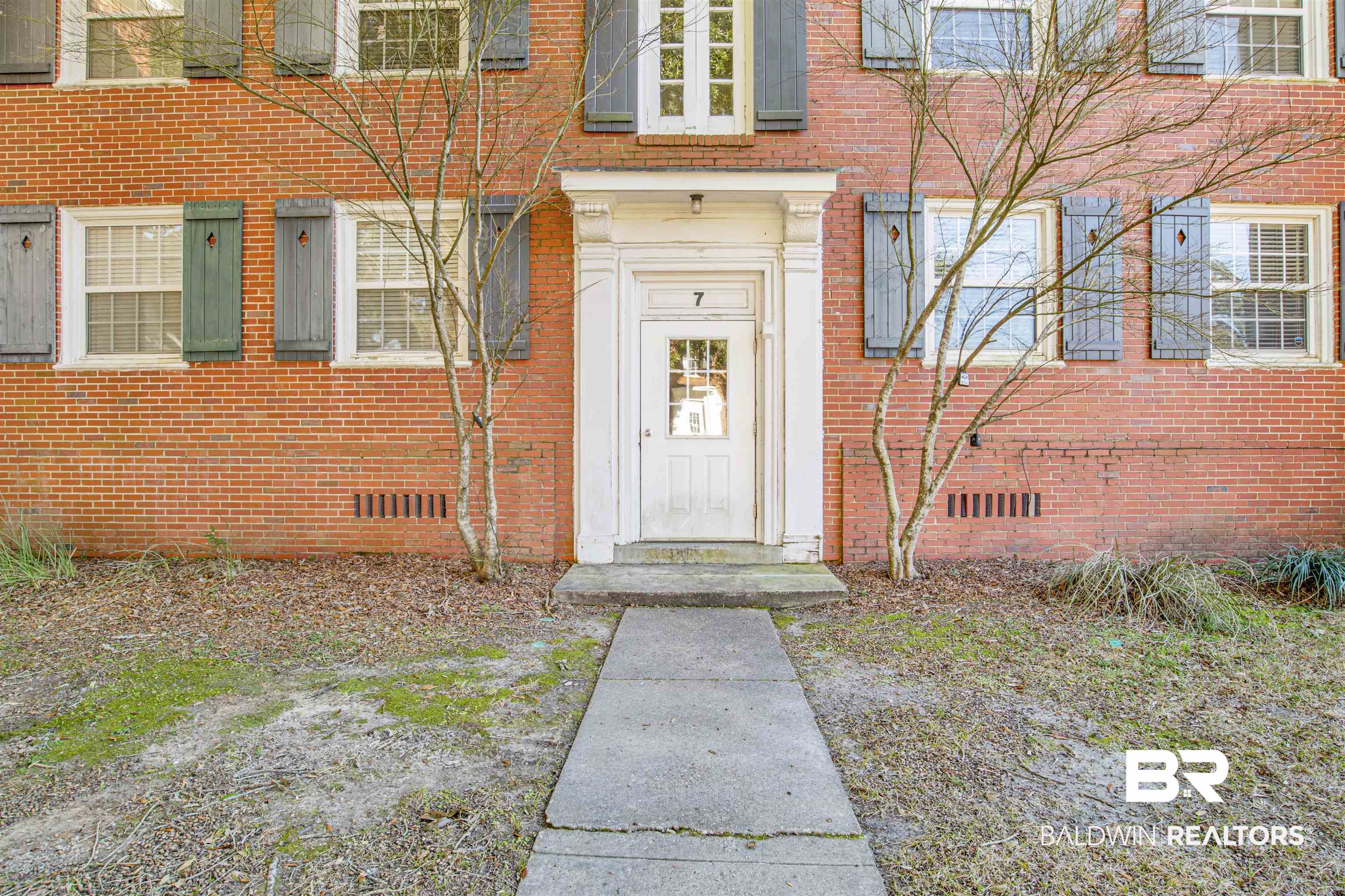214 Upham Street, Unit 7A Mobile, AL 36607 - Photo 25 of 35 View of exterior entry featuring brick siding and crawl space