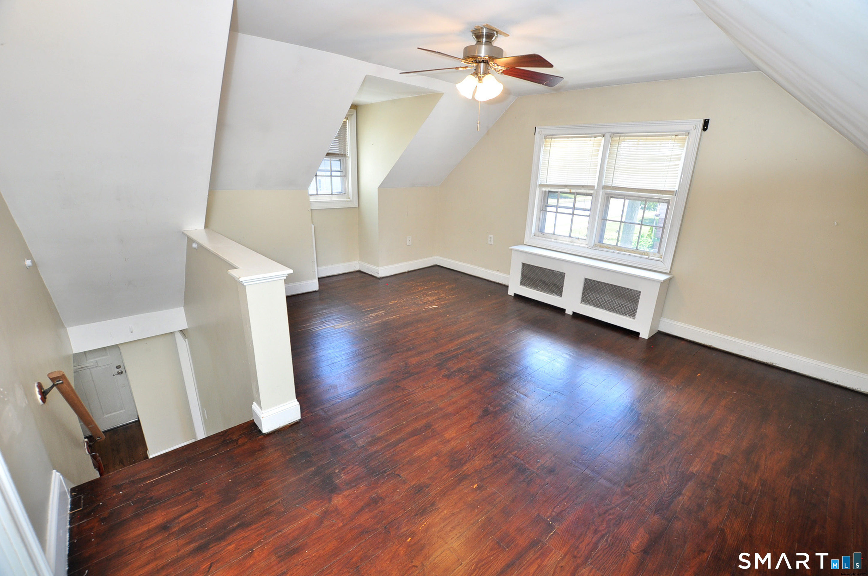 103 West Center Street Manchester, CT 06040 - Photo 25 of 29 wooden floor in an empty room with a window