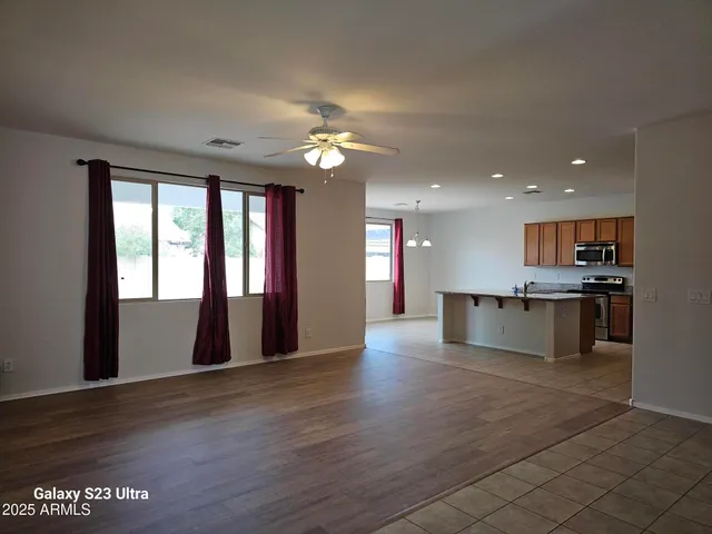 a view of a hallway with closet and cabinet