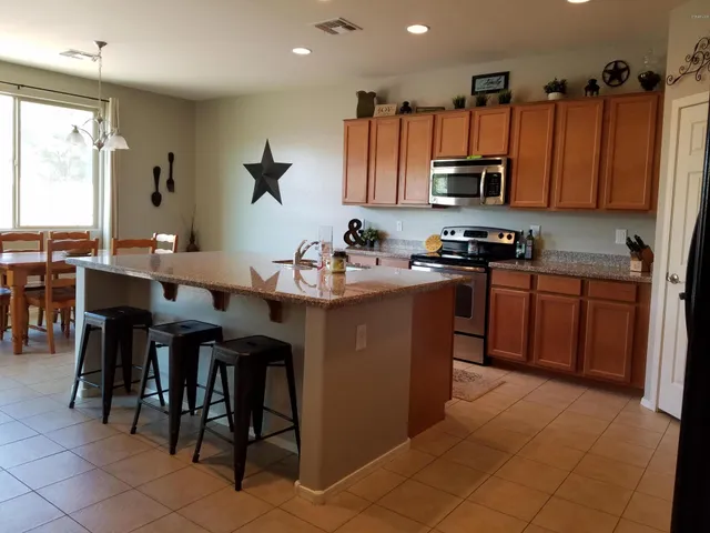 a bathroom with a double vanity sink and mirror