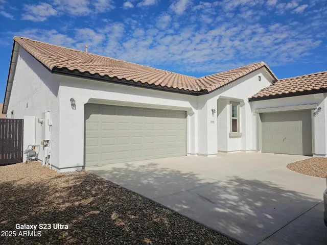 a view of walk in closet with clothes