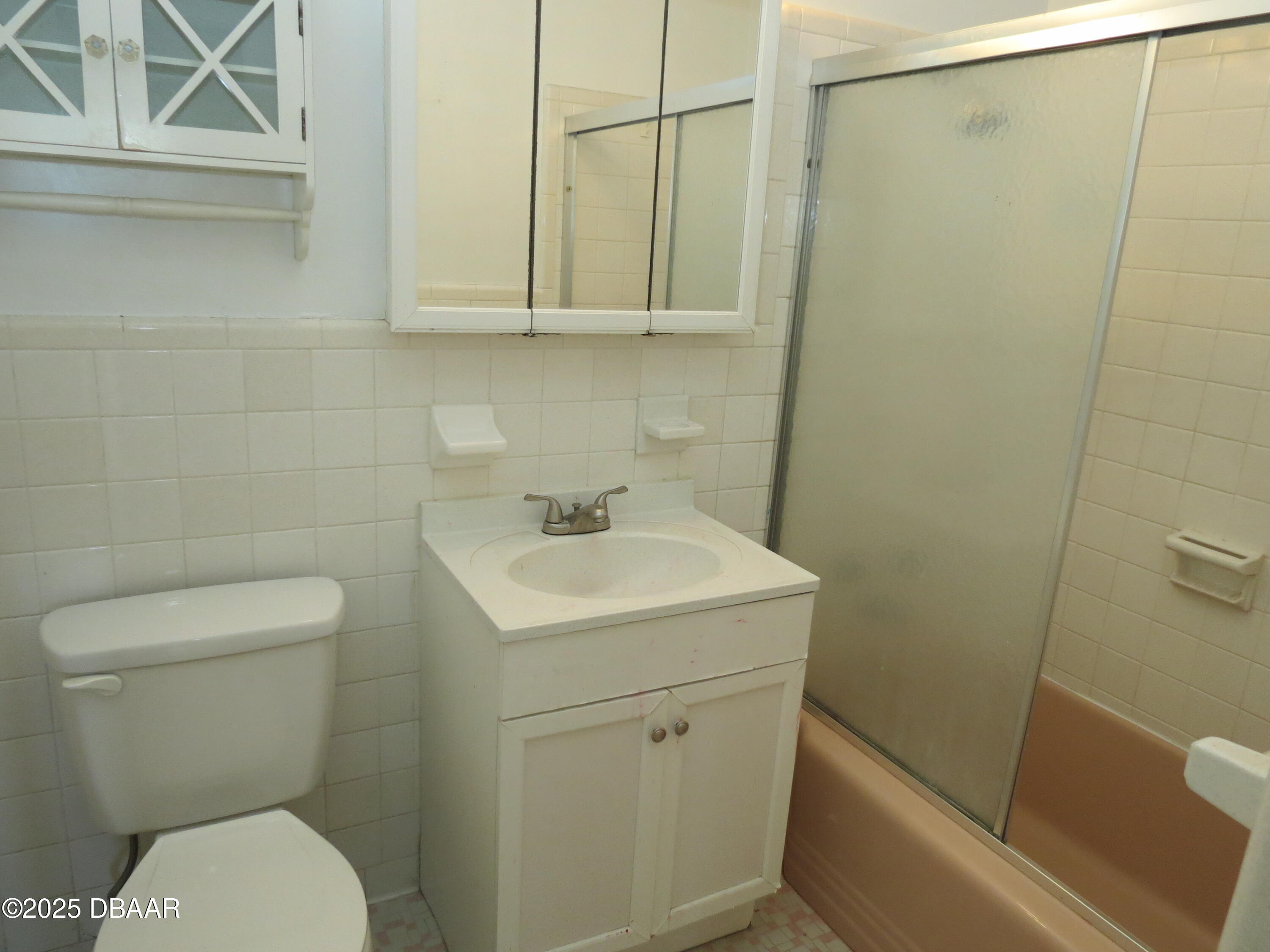 221 Williams Avenue Daytona Beach, FL 32118 - Photo 5 of 15 a white toilet sitting next to a bathroom sink
