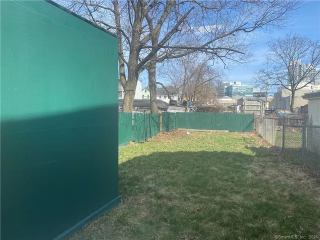 a view of swimming pool with outdoor seating