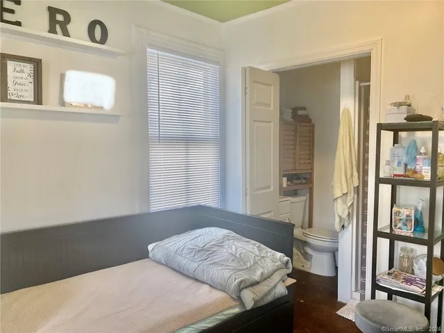 a bathroom with a toilet and a sink