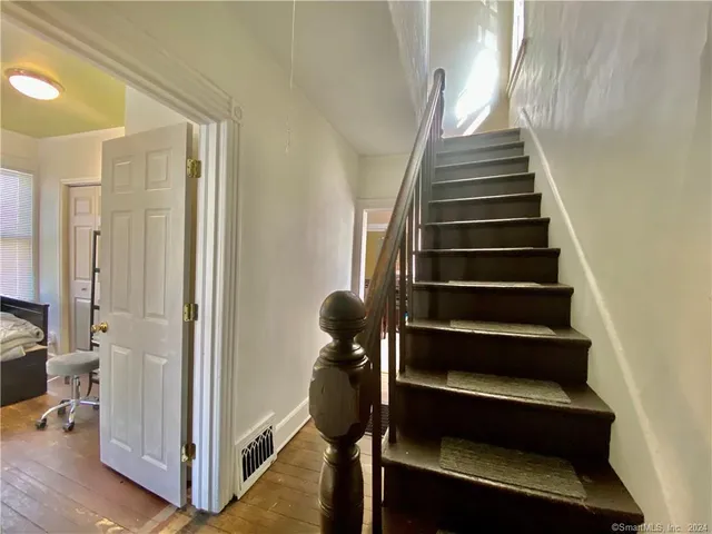 a kitchen with stainless steel appliances a stove a sink and a refrigerator