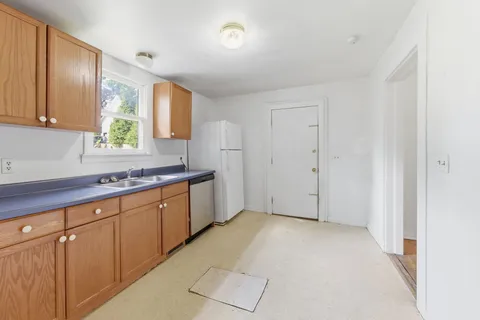 a view of a kitchen with electric appliances