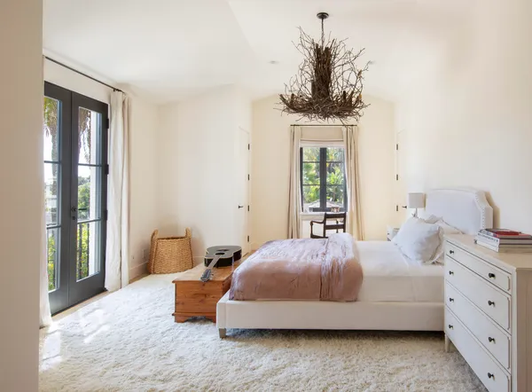 a living room with a large window and a table
