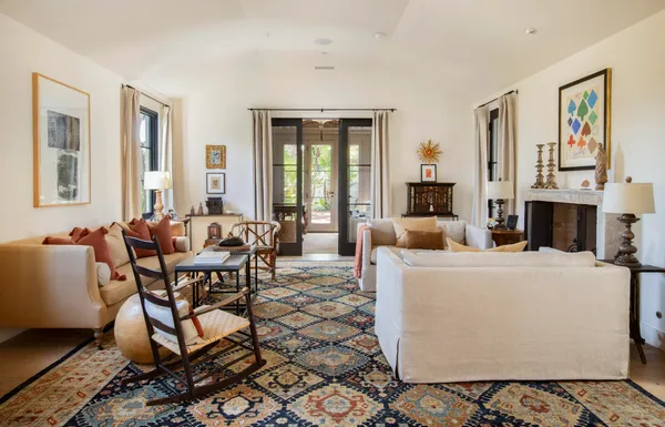 a living room with furniture and a fireplace