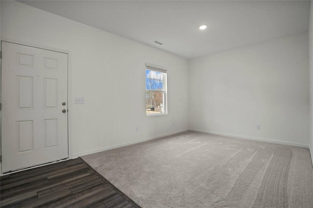 212 Champions Boulevard Dallas, GA 30157 - Photo 11 of 19 an empty room with windows