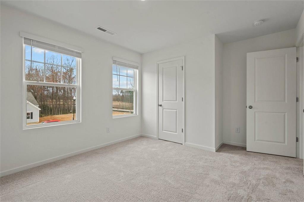 212 Champions Boulevard Dallas, GA 30157 - Photo 18 of 19 a view of an empty room with a window