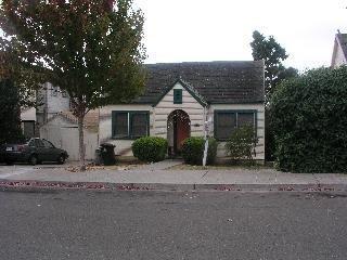 241 Kentucky Street Vallejo, CA 94590 - Photo 1 of 8 a front view of a house with a garden