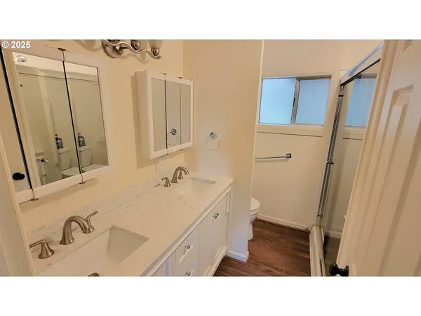 a bathroom with a sink a mirror and a bathtub