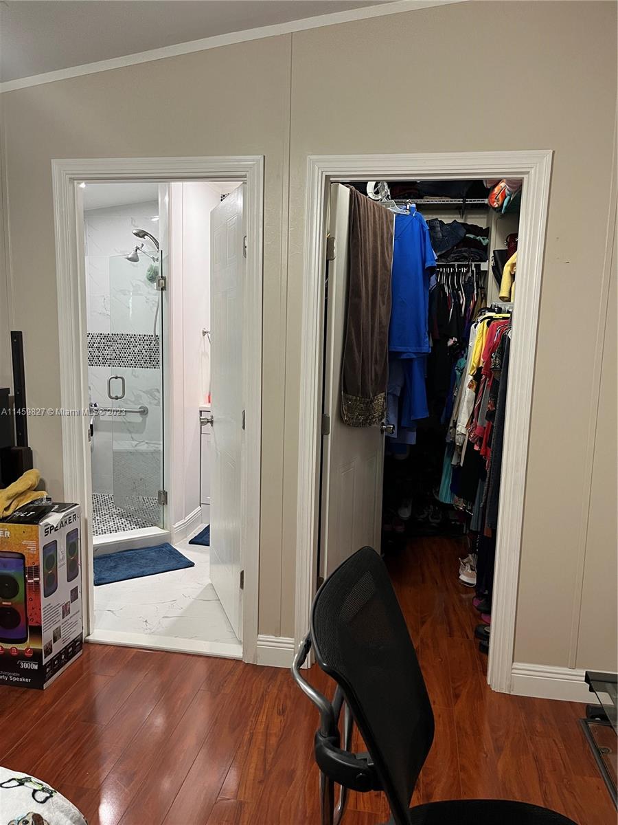 28501 Southwest 152nd Avenue Homestead, FL 33033 - Photo 15 of 32 a view of walk in closet with clothes and shoes