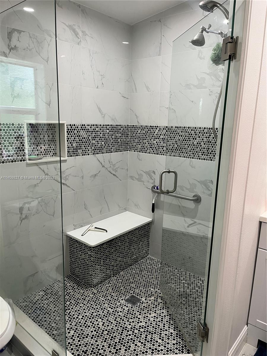 28501 Southwest 152nd Avenue Homestead, FL 33033 - Photo 16 of 32 a bathroom with a bathtub and a shower