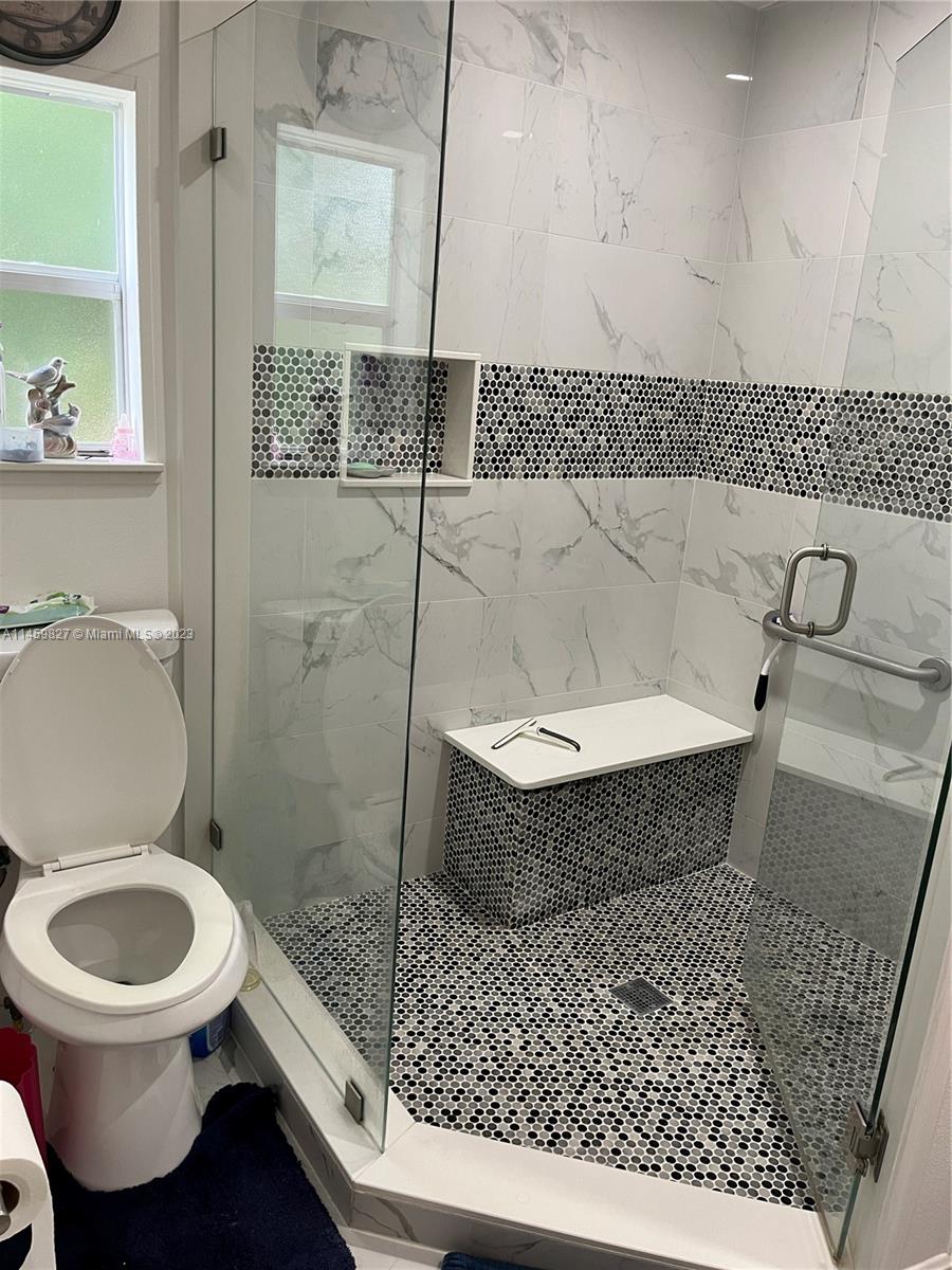 28501 Southwest 152nd Avenue Homestead, FL 33033 - Photo 17 of 32 a bathroom with a toilet and a shower