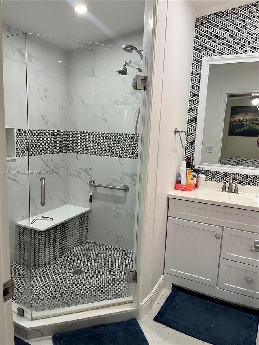 28501 Southwest 152nd Avenue Homestead, FL 33033 - Photo 18 of 32 a bathroom with a sink and a mirror