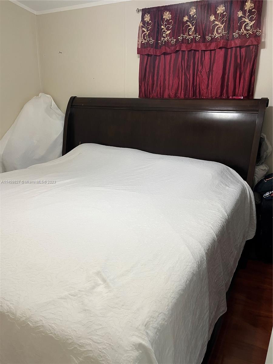 28501 Southwest 152nd Avenue Homestead, FL 33033 - Photo 21 of 32 a bedroom with a bed and a dresser
