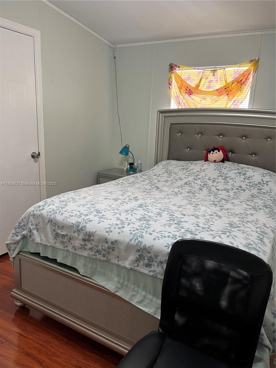 28501 Southwest 152nd Avenue Homestead, FL 33033 - Photo 23 of 32 a bedroom with a bed and window