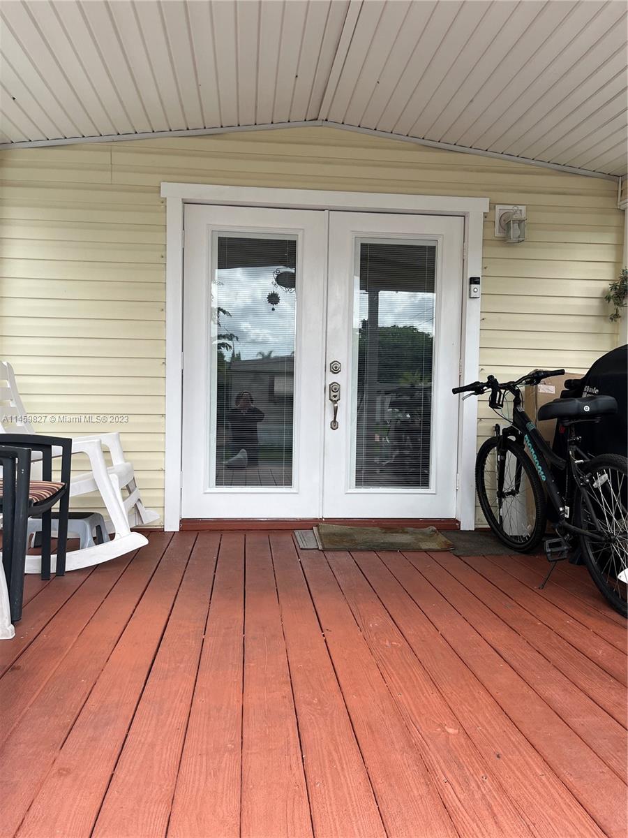28501 Southwest 152nd Avenue Homestead, FL 33033 - Photo 27 of 32 a view of a patio with wooden floor