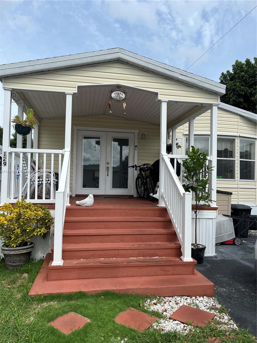28501 Southwest 152nd Avenue Homestead, FL 33033 - Photo 28 of 32 a front view of a house with a porch