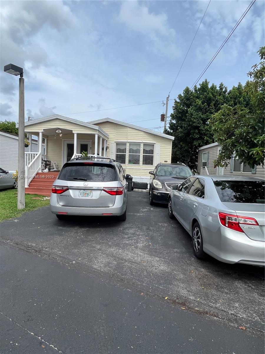 28501 Southwest 152nd Avenue Homestead, FL 33033 - Photo 29 of 32 a car parked in front of a house