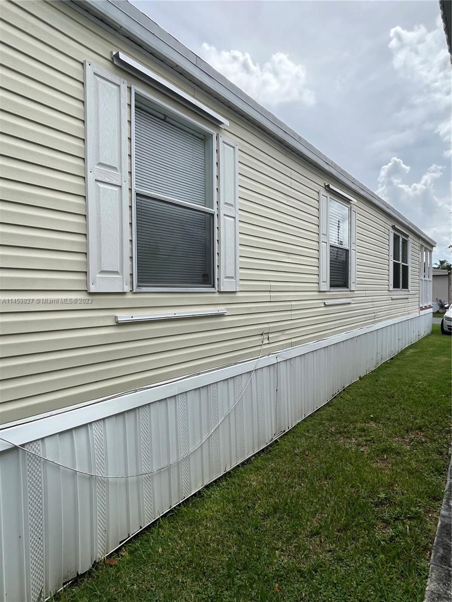 28501 Southwest 152nd Avenue Homestead, FL 33033 - Photo 32 of 32 a view of a house with a yard