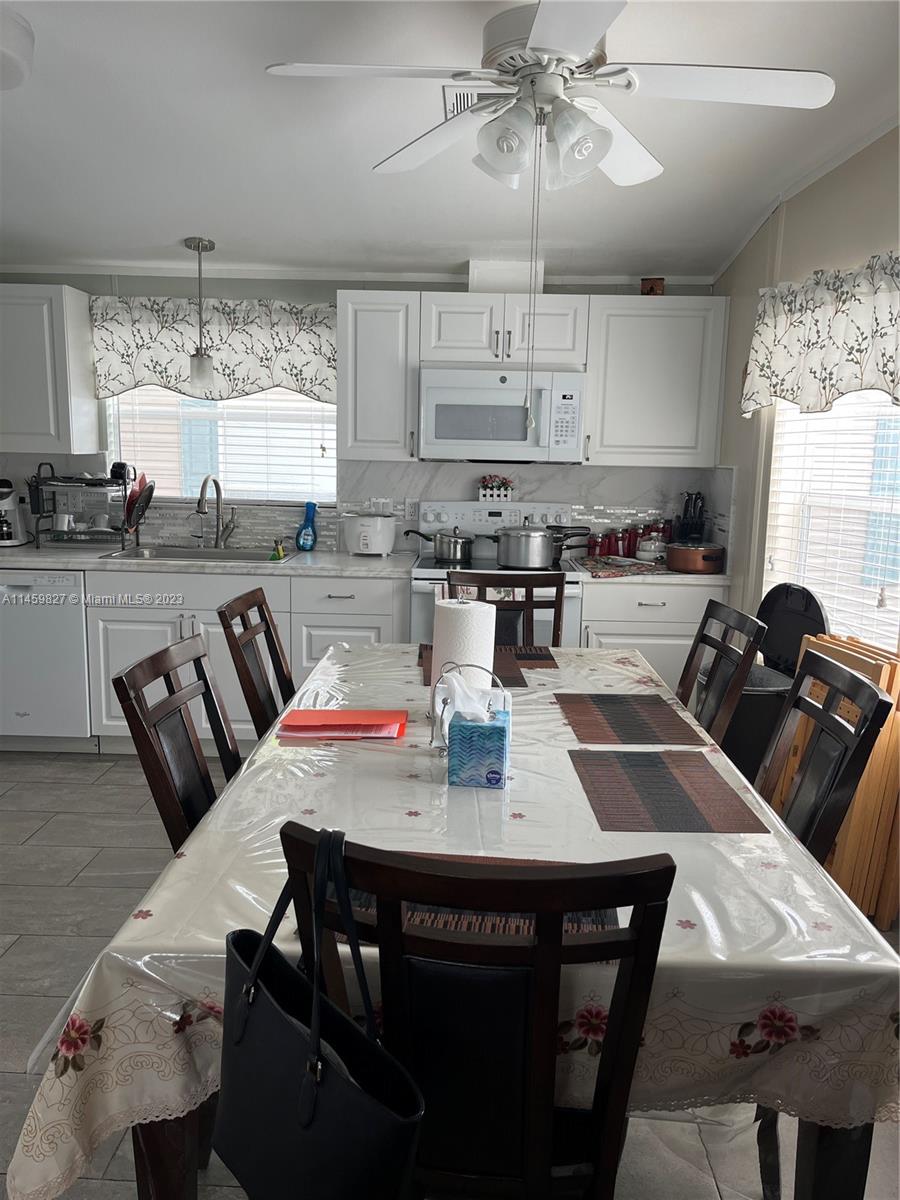 28501 Southwest 152nd Avenue Homestead, FL 33033 - Photo 4 of 32 a view of a dining room with furniture window and outside view